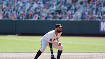 SAN FRANCISCO, CALIFORNIA - SEPTEMBER 24: Brandon Belt #9 of the San Francisco Giants fields at first base against the Colorado Rockies at Oracle Park on September 24, 2020 in San Francisco, California. (Photo by Lachlan Cunningham/Getty Images)