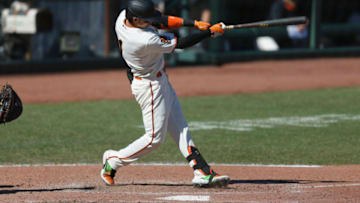 SAN FRANCISCO, CALIFORNIA - SEPTEMBER 24: Mauricio Dubon #1 of the San Francisco Giants hits a double in the bottom of the sixth inning against the Colorado Rockies at Oracle Park on September 24, 2020 in San Francisco, California. (Photo by Lachlan Cunningham/Getty Images)