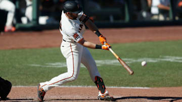 SAN FRANCISCO, CALIFORNIA - SEPTEMBER 24: Evan Longoria #10 of the San Francisco Giants hits a double in the bottom of the eighth inning against the Colorado Rockies at Oracle Park on September 24, 2020 in San Francisco, California. (Photo by Lachlan Cunningham/Getty Images)