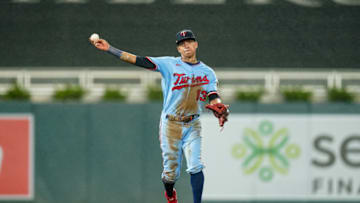 MINNEAPOLIS, MN - SEPTEMBER 26: Ehire Adrianza #13 of the Minnesota Twins throws against the Cincinnati Reds on September 26, 2020 at Target Field in Minneapolis, Minnesota. (Photo by Brace Hemmelgarn/Minnesota Twins/Getty Images)