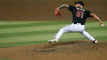 PHOENIX, ARIZONA - SEPTEMBER 26: Relief pitcher Silvino Bracho #61 of the Arizona Diamondbacks throws a pitch against the Colorado Rockies during the sixth inning of the MLB game at Chase Field on September 26, 2020 in Phoenix, Arizona. (Photo by Ralph Freso/Getty Images)