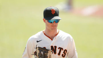 SAN FRANCISCO, CALIFORNIA - SEPTEMBER 27: Mike Yastrzemski #5 of the San Francisco Giants walks to the dugout during the game against the San Diego Padres at Oracle Park on September 27, 2020 in San Francisco, California. (Photo by Lachlan Cunningham/Getty Images)