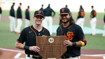SAN FRANCISCO, CALIFORNIA - SEPTEMBER 26: Mike Yastrzemski #5 of the SF Giants is presented with the 2020 Willie Mac Award by teammate Brandon Crawford #35 before the game against the San Diego Padres at Oracle Park on September 26, 2020 in San Francisco, California. (Photo by Lachlan Cunningham/Getty Images)
