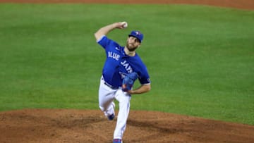 BUFFALO, NY - SEPTEMBER 24: Anthony Bass #52 of the Toronto Blue Jays throws a pitch against the New York Yankees at Sahlen Field on September 24, 2020 in Buffalo, New York. The Blue Jays are the home team due to the Canadian government"u2019s policy on COVID-19, which prevents them from playing in their home stadium in Canada. Blue Jays beat the Yankees 4 to 1. (Photo by Timothy T Ludwig/Getty Images)