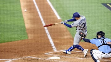 ARLINGTON, TEXAS - OCTOBER 25: Joc Pederson #31 of the Los Angeles Dodgers hits a solo home run against the Tampa Bay Rays during the second inning in Game Five of the 2020 MLB World Series at Globe Life Field on October 25, 2020 in Arlington, Texas. (Photo by Sean M. Haffey/Getty Images)