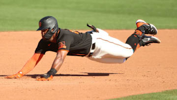 SCOTTSDALE, ARIZONA - MARCH 28: Heliot Ramos #80 of the SF Giants dives safely into second base in the eight inning against the Oakland Athletics during the MLB spring training game at Scottsdale Stadium on March 28, 2021 in Scottsdale, Arizona. (Photo by Abbie Parr/Getty Images)