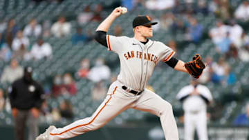 SEATTLE, WASHINGTON - APRIL 03: Logan Webb #62 of the SF Giants pitches against the Seattle Mariners in the first inning at T-Mobile Park on April 03, 2021 in Seattle, Washington. (Photo by Steph Chambers/Getty Images)