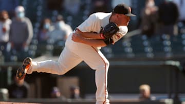 SAN FRANCISCO, CALIFORNIA - APRIL 10: Jake McGee #17 of the San Francisco Giants pitches against the Colorado Rockies in the ninth inning at Oracle Park on April 10, 2021 in San Francisco, California. (Photo by Ezra Shaw/Getty Images)