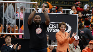 SAN FRANCISCO, CA - OCTOBER 31: San Francisco Giants third baseman Pablo Sandoval acknowledges the crowd in front of Congresswoman Nancy Pelosi during the San Francisco Giants World Series victory parade on October 31, 2014 in San Francisco, California. The San Francisco Giants defeated the Kansas City Royals to win the 2014 World Series. (Photo by Jason O. Watson/Getty Images)