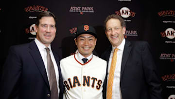 SAN FRANCISCO, CA - JANUARY 20: Norichika Aoki poses for a picture with Larry Baer (right), President and CEO of the San Francisco Giants and Bobby Evans (left), Vice President and Assistant General Manager of the San Francisco Giants after a press conference where he was introduced as the newest Giant at AT