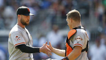 ATLANTA, GA - MAY 06: Pitcher Hunter Strickland #60 is congratulated by catcher Nick Hundley #5 of the San Francisco Giants after the game against the Atlanta Braves at SunTrust Park on May 6, 2018 in Atlanta, Georgia. (Photo by Mike Zarrilli/Getty Images)