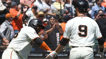 SAN FRANCISCO, CA - MAY 16: Brandon Belt #9 of the San Francisco Giants is congratulated by Pablo Sandoval #48 after Belt hit a solo home run against the Cincinnati Reds in the bottom of the third inning at AT&T Park on May 16, 2018 in San Francisco, California. (Photo by Thearon W. Henderson/Getty Images)
