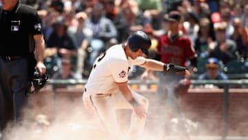 SAN FRANCISCO, CA - JUNE 06: Joe Panik #12 of the San Francisco Giants slides in to home plate to score on a double hit by Andrew McCutchen #22 in the third inning against the Arizona Diamondbacks at AT&T Park on June 6, 2018 in San Francisco, California. (Photo by Ezra Shaw/Getty Images)