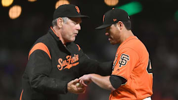 SAN FRANCISCO, CA - AUGUST 18: Manager Bruce Bochy #15 of the San Francisco Giants takes the ball from Matt Moore #45 taking Moore out of the game against the Philadelphia Phillies in the top of the eighth inning at AT&T Park on August 18, 2017 in San Francisco, California. The Giants won the game 10-2. (Photo by Thearon W. Henderson/Getty Images)