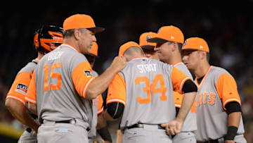 PHOENIX, AZ - AUGUST 27: Manager Bruce Bochy #15 talks with Chris Stratton #34 of the San Francisco Giants both wearing nickname-bearing jerseys in the sixth inning of the MLB game against the Arizona Diamondbacks at Chase Field on August 27, 2017 in Phoenix, Arizona. (Photo by Jennifer Stewart/Getty Images)