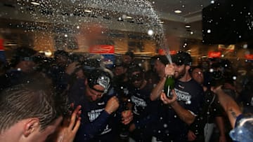 LOS ANGELES, CA - SEPTEMBER 22: Tony Cingrani #54 of the Los Angeles Dodgers sprays champagne in the clubhouse after their 4-2 win a MLB game against the San Francisco Giants to clinch their fifth consecutive National League West Division title at Dodger Stadium on September 22, 2017 in Los Angeles, California. (Photo by Victor Decolongon/Getty Images)