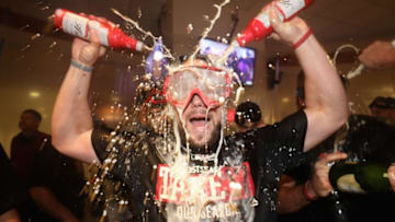 PHOENIX, AZ - SEPTEMBER 24: Chris Owings #16 of the Arizona Diamondbacks celebrates in the clubhouse after defeating the Miami Marlins and clinching a post season birth following the MLB game at Chase Field on September 24, 2017 in Phoenix, Arizona. The Diamondbacks defeated the Marlins 3-2. (Photo by Christian Petersen/Getty Images)