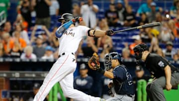 MIAMI, FL - OCTOBER 1: Giancarlo Stanton #27 of the Miami Marlins strikes out in the ninth inning in front of Kurt Suzuki #24 of the Atlanta Braves, ending his bid for 60 home runs for the season at Marlins Park on October 1, 2017 in Miami, Florida. (Photo by Joe Skipper/Getty Images)