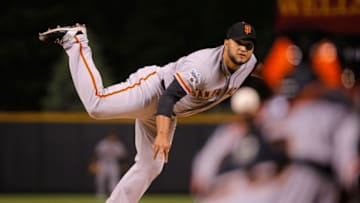 DENVER, CO - MAY 23: Starting pitcher Yusmeiro Petit #52 of the San Francisco Giants delivers against the Colorado Rockies during the second game of a double header at Coors Field on May 23, 2015 in Denver, Colorado. (Photo by Doug Pensinger/Getty Images)