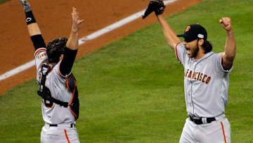 KANSAS CITY, MO - OCTOBER 29: Buster Posey #28 and Madison Bumgarner #40 of the San Francisco Giants celebrate after defeating the Kansas City Royals to win Game Seven of the 2014 World Series by a score of 3-2 at Kauffman Stadium on October 29, 2014 in Kansas City, Missouri. (Photo by Doug Pensinger/Getty Images)