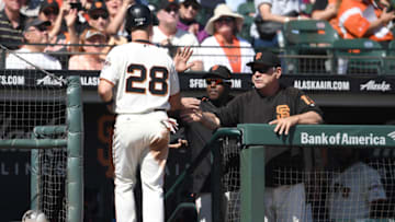 SAN FRANCISCO, CA - OCTOBER 01: Buster Posey #28 of the San Francisco Giants is congratulated by manager Bruce Bochy #15 after Posey scored against the San Diego Padres in the bottom of the fourth inning at AT&T Park on October 1, 2017 in San Francisco, California. (Photo by Thearon W. Henderson/Getty Images)