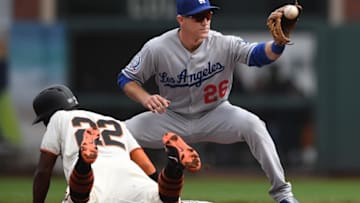 SAN FRANCISCO, CA - APRIL 07: Andrew McCutchen #22 of the San Francisco Giants dives back into second base safe ahead of the throw to Chase Utley #26 of the Los Angeles Dodgers in the top of the first inning at AT&T Park on April 7, 2018 in San Francisco, California. (Photo by Thearon W. Henderson/Getty Images)