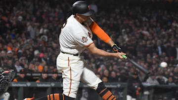 SAN FRANCISCO, CA - APRIL 10: Hunter Pence #8 of the San Francisco Giants hits an rbi sacrifice fly scoring Brandon Belt #9 against the Arizona Diamondbacks in the bottom of the six inning at AT&T Park on April 10, 2018 in San Francisco, California. (Photo by Thearon W. Henderson/Getty Images)
