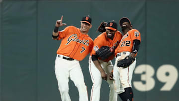 SAN FRANCISCO, CA - APRIL 27: (L-R) Gorkys Hernandez #7, Austin Jackson #16 and Andrew McCutchen #22 of the San Francisco Giants celebrate after they beat the Los Angeles Dodgers at AT&T Park on April 27, 2018 in San Francisco, California. (Photo by Ezra Shaw/Getty Images)
