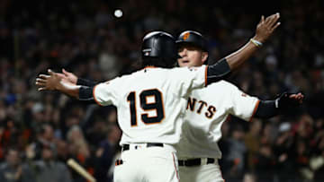 SAN FRANCISCO, CA - JUNE 04: Alen Hanson #19 and Joe Panik #12 of the San Francisco Giants celebrate after they scored on a hit by Buster Posey #28 of the San Francisco Giants in the fourth inning against the Arizona Diamondbacks at AT&T Park on June 4, 2018 in San Francisco, California. (Photo by Ezra Shaw/Getty Images)