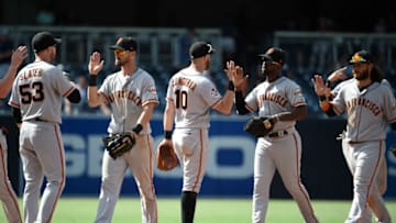 SAN DIEGO, CA - JULY 31: San Francisco Giants players high-five after beating the San Diego Padres 3-2 in a baseball game PETCO Park on July 31, 2018 in San Diego, California. (Photo by Denis Poroy/Getty Images)