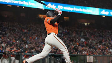 SAN FRANCISCO, CA - AUGUST 31: Chris Shaw #26 of the San Francisco Giants in his major league debut hits a sacrifice fly scoring Brandon Belt #9 in the bottom of the seventh inning at AT&T Park on August 31, 2018 in San Francisco, California. (Photo by Thearon W. Henderson/Getty Images)