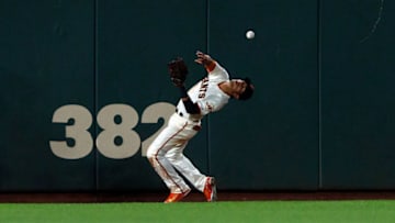 SAN FRANCISCO, CA - SEPTEMBER 10: Gorkys Hernandez #7 of the San Francisco Giants is unable to field a ball hit for a double by Kurt Suzuki (not pictured) of the Atlanta Braves during the ninth inning at AT&T Park on September 10, 2018 in San Francisco, California. The Atlanta Braves defeated the San Francisco Giants 4-1. (Photo by Jason O. Watson/Getty Images)
