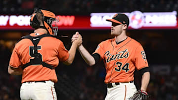 SAN FRANCISCO, CA - SEPTEMBER 14: Chris Stratton #34 and Nick Hundley #5 of the San Francisco Giants celebrate defeating the Colorado Rockies 2-0 at AT&T Park on September 14, 2018 in San Francisco, California. Stratton pitched a complete game. (Photo by Thearon W. Henderson/Getty Images)