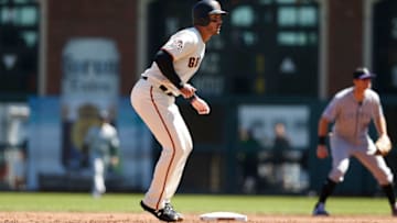 SAN FRANCISCO, CA - SEPTEMBER 16: Base runner Chris Shaw #26 of the San Francisco Giants leads off of second base in the second inning against the Colorado Rockies at AT&T Park on September 16, 2018 in San Francisco, California. (Photo by Lachlan Cunningham/Getty Images)