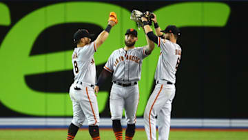 TORONTO, ON - APRIL 24: Gerardo Parra #8, Kevin Pillar #1 and Steven Duggar #6 of the San Francisco Giants congratulate each other following victory over the Toronto Blue Jays in a MLB game at Rogers Centre on April 24, 2019 in Toronto, Canada. (Photo by Vaughn Ridley/Getty Images)