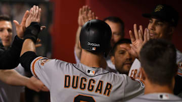 PHOENIX, ARIZONA - MAY 18: Steven Duggar #6 of the San Francisco Giants celebrates with teammates in the dugout after scoring on an RBI single by Buster Posey #28 during the third inning against the Arizona Diamondbacks at Chase Field on May 18, 2019 in Phoenix, Arizona. (Photo by Norm Hall/Getty Images)