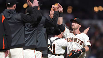 SAN FRANCISCO, CA - JULY 22: Austin Slater #53 of the San Francisco Giants and teammates celebrates defeating the Chicago Cubs 5-4 at Oracle Park on July 22, 2019 in San Francisco, California. (Photo by Thearon W. Henderson/Getty Images)