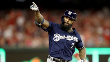 WASHINGTON, DC - OCTOBER 01: Eric Thames #7 of the Milwaukee Brewers celebrates after scoring a home run against Max Scherzer #31 of the Washington Nationals during the second inning in the National League Wild Card game at Nationals Park on October 01, 2019 in Washington, DC. (Photo by Rob Carr/Getty Images)