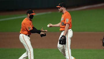 Sam Coonrod #65 of the SF Giants is relieved by manager Gabe Kapler. (Photo by Jason O. Watson/Getty Images)
