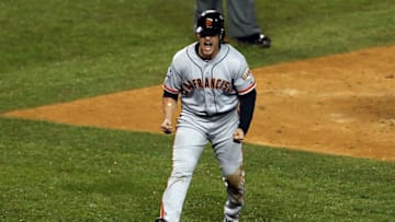 DETROIT, MI - OCTOBER 28: Ryan Theriot #5 of the San Francisco Giants celebrates after scoring a run off of Marco Scutaro #19 RBI single against Phil Coke #40 of the Detroit Tigers in the tenth inning during Game Four of the Major League Baseball World Series at Comerica Park on October 28, 2012 in Detroit, Michigan. (Photo by Jonathan Daniel/Getty Images)