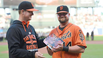 San Francisco Giants' Casey McGehee (right) receives the Players Choice Award for the 2014 National League Comeback Player of the Year (Photo by Thearon W. Henderson/Getty Images)