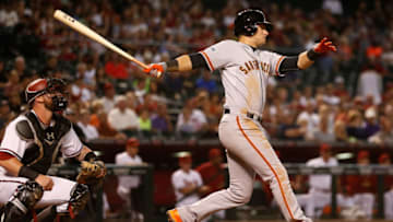 PHOENIX, AZ - SEPTEMBER 08: Joe Panik #12 of the San Francisco Giants hits a RBI double against the Arizona Diamondbacks during the third inning of the MLB game at Chase Field on September 8, 2015 in Phoenix, Arizona. (Photo by Christian Petersen/Getty Images)