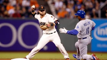 SAN FRANCISCO, CA - SEPTEMBER 30: Brandon Crawford #35 of the San Francisco Giants turns a double play as Jimmy Rollins #11 of the Los Angeles Dodgers slides into second base on a ball hit by Corey Seager #5 in the first inning at AT&T Park on September 30, 2015 in San Francisco, California. (Photo by Ezra Shaw/Getty Images)