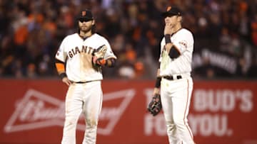 SAN FRANCISCO, CA - OCTOBER 11: Brandon Crawford #35 and Joe Panik #12 of the San Francisco Giants stand on the field during a pitching change in the ninth inning of Game Four of their National League Division Series at AT&T Park on October 11, 2016 in San Francisco, California. (Photo by Ezra Shaw/Getty Images)