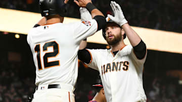 SAN FRANCISCO, CA - APRIL 24: Brandon Belt #9 of the San Francisco Giants is congratulated by Joe Panik #12 after hitting a two-run home run against the Washington Nationals in the bottom of the third inning at AT&T Park on April 24, 2018 in San Francisco, California. (Photo by Thearon W. Henderson/Getty Images)