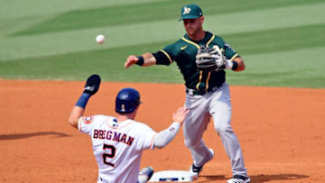 Oct 8, 2020; Los Angeles, California, USA; Oakland Athletics second baseman Tommy La Stella (3) forces out Houston Astros third baseman Alex Bregman (2) at second base during the third inning during game four of the 2020 ALDS at Dodger Stadium. Mandatory Credit: Jayne Kamin-Oncea-USA TODAY Sports