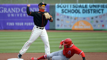 SF Giants infielder Donovan Solano (7) throws to first against the Los Angeles Angels during the first inning at Scottsdale Stadium. (Joe Camporeale-USA TODAY Sports)