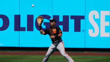 Mar 11, 2021; Tempe, Arizona, USA; SF Giants center fielder LaMonte Wade Jr. (31) makes the catch against the Los Angeles Angels during a spring training game at Tempe Diablo Stadium. (Rick Scuteri-USA TODAY Sports)