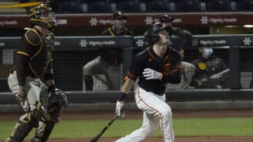 Mar 24, 2021; Scottsdale, Arizona, USA; SF Giants right fielder Mike Yastrzemski (5) hits a homerun against the San Diego Padres during a spring training game at Scottsdale Stadium. (Rick Scuteri-USA TODAY Sports)