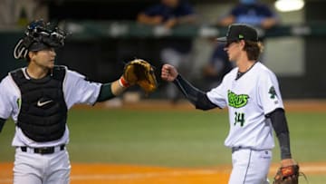 Eugene Emeralds catcher Patrick Bailey, left, congratulates pitcher Travis Perry at the end of the fifth inning against the Hillsboro Hops at PK Park in Eugene.
